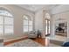 Elegant foyer with wood floors, arched windows and a view of the home office at 3852 Brantley Place Cir, Apopka, FL 32703