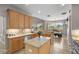 Bright kitchen with granite counters, stainless appliances, and tile flooring throughout at 3852 Brantley Place Cir, Apopka, FL 32703