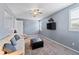 Cozy living room features a TV, ceiling fan, and comfortable seating, creating a relaxing atmosphere at 3852 Brantley Place Cir, Apopka, FL 32703