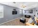 Cozy living room features a TV, ceiling fan, and comfortable seating, creating a relaxing atmosphere at 3852 Brantley Place Cir, Apopka, FL 32703