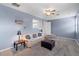 Relaxing living area with carpet, sofa, ottoman, and comfortable decor at 3852 Brantley Place Cir, Apopka, FL 32703