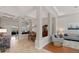 Open concept living and dining areas with coffered ceilings, tile flooring, and hardwood accents at 3852 Brantley Place Cir, Apopka, FL 32703