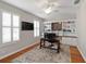 Office with hardwood flooring, a ceiling fan, and built-in shelving and cabinets at 3852 Brantley Place Cir, Apopka, FL 32703