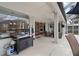 Outdoor patio area showing dining area and views to indoor living areas, pool, and fireplace at 3852 Brantley Place Cir, Apopka, FL 32703
