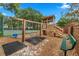 A wonderful neighborhood playground featuring swings, a play structure, and a bench at 3852 Brantley Place Cir, Apopka, FL 32703