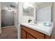 Bathroom with a white countertop, wood cabinets, and a modern faucet at 8904 Candy Palm Rd, Kissimmee, FL 34747