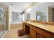 Bright bathroom featuring granite countertops, double sinks, soaking tub, and glass-enclosed shower at 8904 Candy Palm Rd, Kissimmee, FL 34747