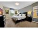 Comfortable bedroom with a large bed and neutral decor at 8904 Candy Palm Rd, Kissimmee, FL 34747