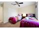 Themed bedroom with twin beds, playful decor, and a ceiling fan for comfort at 8904 Candy Palm Rd, Kissimmee, FL 34747