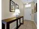 Inviting entryway features tile floors, a console table, and natural light at 8904 Candy Palm Rd, Kissimmee, FL 34747