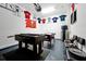 Garage setup as a game room with foosball, pool table, and fun decor at 8904 Candy Palm Rd, Kissimmee, FL 34747