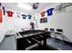 Entertaining garage with a foosball table, sports memorabilia, and game area at 8904 Candy Palm Rd, Kissimmee, FL 34747