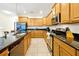 Spacious kitchen with granite countertops, stainless steel appliances, and ample cabinet space at 8904 Candy Palm Rd, Kissimmee, FL 34747