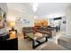 Open-concept living room and dining area with view of the kitchen at 8904 Candy Palm Rd, Kissimmee, FL 34747