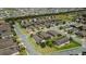 An aerial perspective of a well-planned neighborhood with neatly arranged homes and green spaces at 1005 Salamanca Pl, Davenport, FL 33837