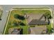 An aerial view showing the property's screened-in patio and manicured lawn at 1005 Salamanca Pl, Davenport, FL 33837