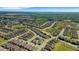 Expansive aerial view of a residential community, showcasing numerous homes and landscaped surroundings at 1005 Salamanca Pl, Davenport, FL 33837