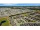 Overhead shot of a large residential area presenting similar homes with lush greenery and expansive lots at 1005 Salamanca Pl, Davenport, FL 33837