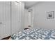 Spare bedroom with a patterned quilt and a view into a walk-in closet at 1005 Salamanca Pl, Davenport, FL 33837