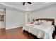 Bright bedroom with hardwood floors, neutral walls, and a decorative bed frame at 1005 Salamanca Pl, Davenport, FL 33837