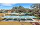 Overhead view of the community bocce ball courts with shaded seating areas at 1005 Salamanca Pl, Davenport, FL 33837