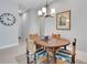 Cozy dining area features a round table with seating for four and a view of the entryway at 1005 Salamanca Pl, Davenport, FL 33837