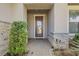 Home's front entry with stone accents, a tiled floor, and a decorative front door at 1005 Salamanca Pl, Davenport, FL 33837