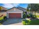 Attractive single-story home featuring a brick paved driveway and two-car garage at 1005 Salamanca Pl, Davenport, FL 33837