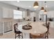 Well-lit kitchen features a large island, granite countertops, stainless steel appliances, and a breakfast bar at 1005 Salamanca Pl, Davenport, FL 33837