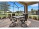 Inviting screened patio with table set providing an ideal outdoor living area at 1005 Salamanca Pl, Davenport, FL 33837