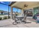 Enclosed patio features brick flooring and a dining set, perfect for outdoor entertaining at 1005 Salamanca Pl, Davenport, FL 33837