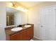 Bathroom with double vanity, granite countertops, and tile flooring at 1039 Tourmaline Dr, Kissimmee, FL 34746