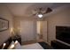 Comfortable bedroom featuring a modern bed, closet and mounted television at 1039 Tourmaline Dr, Kissimmee, FL 34746