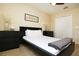 This bedroom offers neutral-toned walls, a black accent bed frame, and a minimalist aesthetic, creating a serene atmosphere at 1039 Tourmaline Dr, Kissimmee, FL 34746
