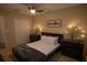 Comfortable bedroom with a modern bed, decorative lighting, and ample closet space at 1039 Tourmaline Dr, Kissimmee, FL 34746