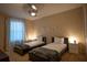 Comfortable bedroom featuring two twin beds with soft neutral decor and window at 1039 Tourmaline Dr, Kissimmee, FL 34746