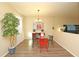Bright dining area features a modern chandelier and glass table at 1039 Tourmaline Dr, Kissimmee, FL 34746