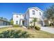 Charming two-story home with a well-maintained lawn, complemented by a two-car garage at 1039 Tourmaline Dr, Kissimmee, FL 34746