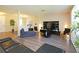 Open-concept living room features recessed lighting and entertainment center at 1039 Tourmaline Dr, Kissimmee, FL 34746