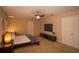 Spacious main bedroom featuring a modern bed, TV, and ample closet space at 1039 Tourmaline Dr, Kissimmee, FL 34746