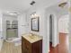 Bright bathroom featuring a stand-up shower, a vanity, a window, and wood-look floors at 1067 Ronlin St, Haines City, FL 33844