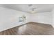 Bright bedroom with a decorative window that offers great natural light and wood-look flooring at 1067 Ronlin St, Haines City, FL 33844