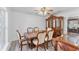 Formal dining room featuring a wood table, upholstered chairs, and hardwood floors at 1067 Ronlin St, Haines City, FL 33844