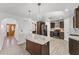 Spacious kitchen with stainless appliances, center island, and white cabinets at 1067 Ronlin St, Haines City, FL 33844