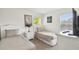 Bright bedroom with twin beds, neutral linens, and stylish bedside lamps at 1119 Mariner Cay Dr, Haines City, FL 33844