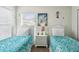 Bedroom featuring two beds with beautiful matching decor and plenty of sunlight at 1119 Mariner Cay Dr, Haines City, FL 33844