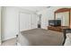 Bright bedroom with closet, mirror, and doorway leading into an adjacent room at 1119 Mariner Cay Dr, Haines City, FL 33844