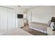 Neutral bedroom featuring twin beds with comfortable quilts and white dresser with television at 1119 Mariner Cay Dr, Haines City, FL 33844