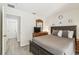 Bright bedroom featuring a doorway leading into an adjacent room and ensuite bathroom at 1119 Mariner Cay Dr, Haines City, FL 33844