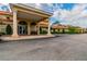 Exterior view of the community clubhouse featuring a grand entryway with columns and a covered portico at 1119 Mariner Cay Dr, Haines City, FL 33844
